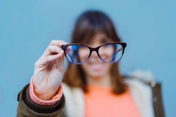 Selective focus on the frame and blurred unrecognizable woman at the background.