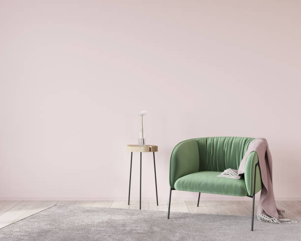 istock Soft green armchair on a pink wall background 1211608238
