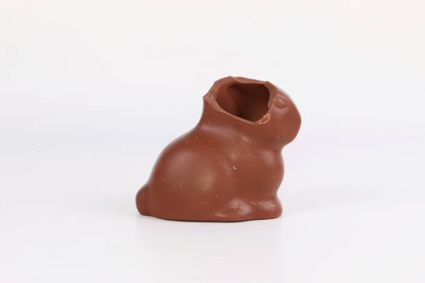 istock eaten chocolate easter bunny stands in white studio 1211609581