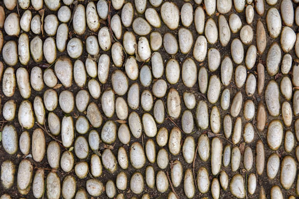 istock Pavement of smooth oval cobblestones. 1211610605