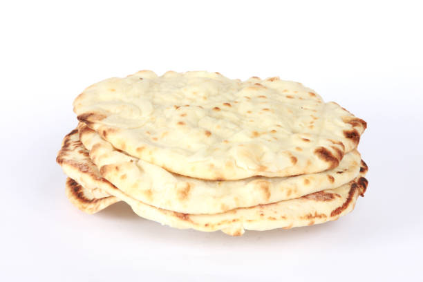 istock Indian Cuisine Naan Bread served as side dish 1211611078
