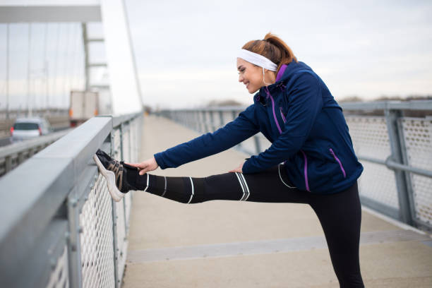istock Woman exercising on the bridge 1211611166