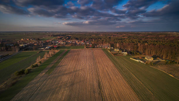 istock Polish village and nearby fields illuminated by the setting sun. 1211612431