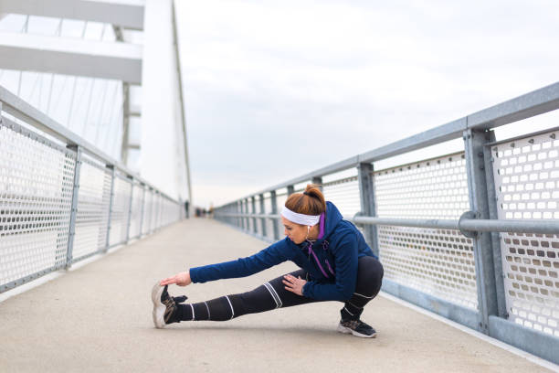 istock Woman exercising on the bridge 1211612432