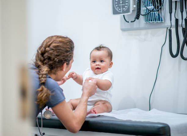 baby boy at the doctor zdjęcie stockowe - patient male nurse nurse hospital zdjęcia i obrazy z banku zdjęć