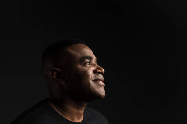 istock Profile of a smiling and hopeful man 1211615189
