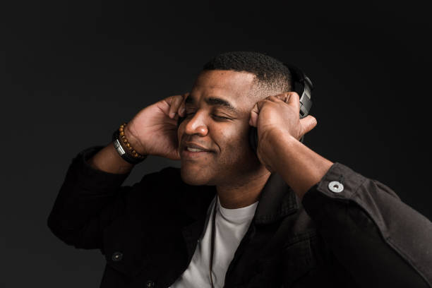 istock Happy man feeling the music with headset 1211615196