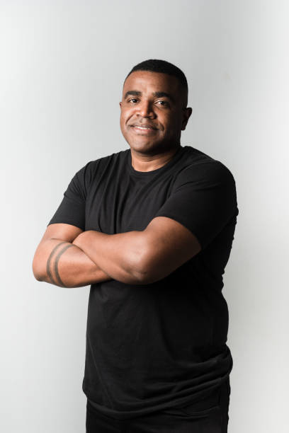 istock Adult man wearing black clothes on white background 1211615201