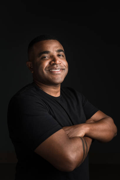 istock Friendly man with crossed arms in studio 1211615210