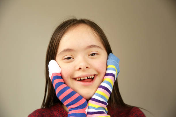 istock Beautiful girl smiling with different socks 1211615581