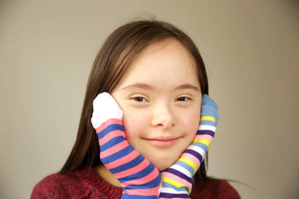 istock Beautiful girl smiling with different socks 1211615585