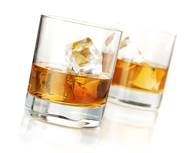 istock Two half full glasses of whiskey on the rocks 121161720