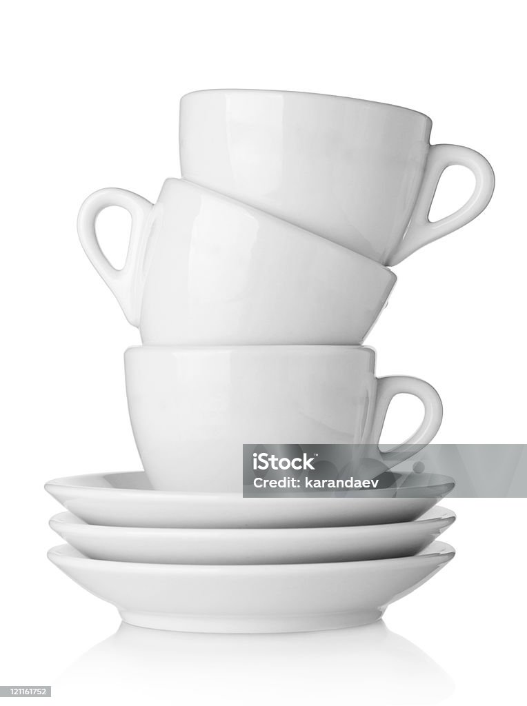 Tazze di caffè con piattini - Foto stock royalty-free di Bianco