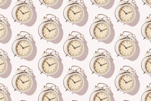 Hipster pink seamless pattern backdrop with alarm clock. Minimal concept art. Time concept.