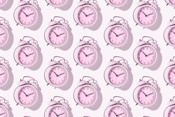 istock Hipster pink seamless pattern backdrop with alarm clock. Minimal concept art. Time concept. 1211618732
