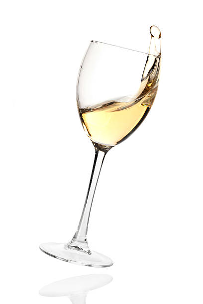 istock Splashing white wine in a falling glass 121161910