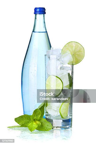 Glass Of Water With Lime And Ice Stock Photo - Download Image Now - Freshness, Cold Temperature, Water Bottle