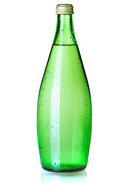 A large green glass bottle filled with carbonated water