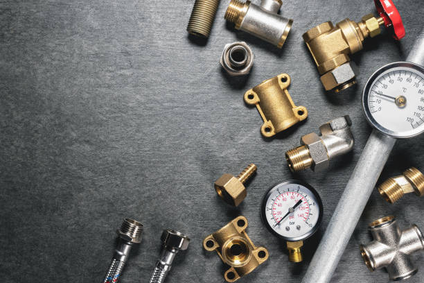 Plumbing. Plumbing equipment on gray flat lay background with copy space. machine part photos stock pictures, royalty-free photos & images