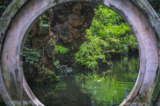 View of a traditional Chinese garden with water pond in the garden of the Wenshu Monastery, Chengdu, Sichuan Province, China