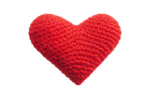Red thread-called handmade heart on a white background isolated. Symbol of love and Saint Valentine's day greetings, to indicate the actual heart or love. Knitted texture