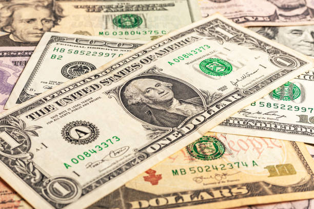 istock Close-up of multiple American dollar banknotes. 1211623893