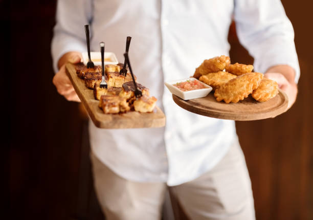 istock Serving food in his cafe 1211624849