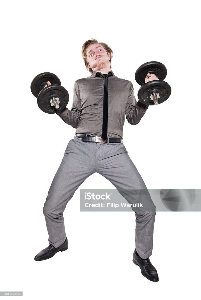 Its really heavy Young man in necktie training with dumbbell. Isolated on white background. Anaerobic Exercise Stock Photo