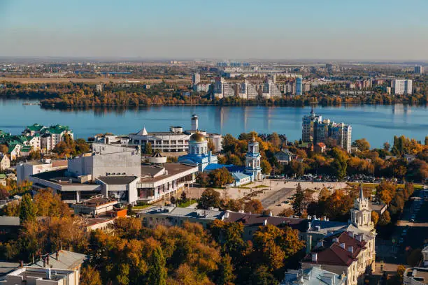 Sunny golden autumn Voronezh. Aerial view from skyscraper roof height.