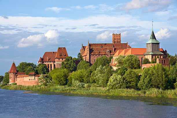 Malbork Castle Malbork Castle. View from opposite river bank. The largest brick building. malbork photos stock pictures, royalty-free photos & images