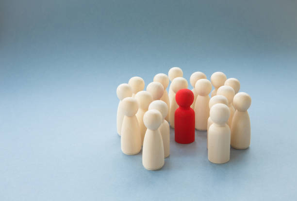 a manager, boss or diverse figure surrounded by a crowd for being different - surrounding leadership organization meeting imagens e fotografias de stock