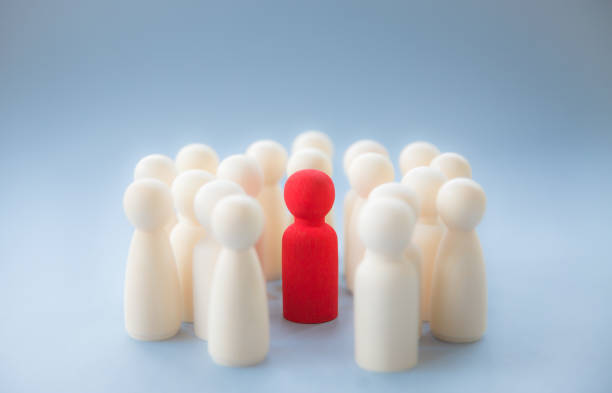 a manager, boss or diverse figure surrounded by a crowd for being different - surrounding leadership organization meeting imagens e fotografias de stock