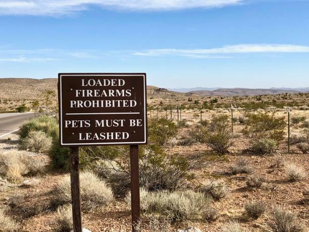 istock warning sign on barren landscape 1211628975