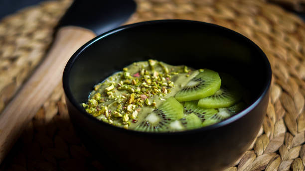 istock Avocado mousse with slices kiwi and crumbs phistachios 1211630746