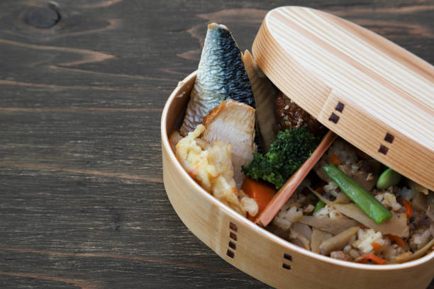 Japanese styled lunch in the wooden lunch box made from cedar. Japanese styled lunch in the wooden lunch box made from cedar. cryptomeria stock pictures, royalty-free photos & images
