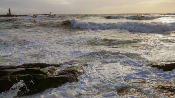 istock Colorful dramatic seascape with dark clouds and sun beams. Ocean surf. 1211637506