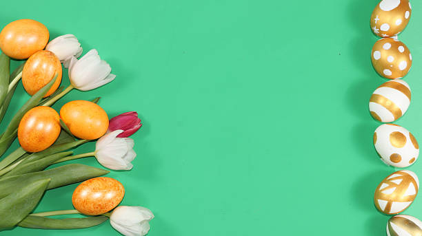istock Decorated golden easter eggs on trendy green background. Minimal holiday concept. Happy Easter background, place for text, postcard, banner for the screen. 1211637777
