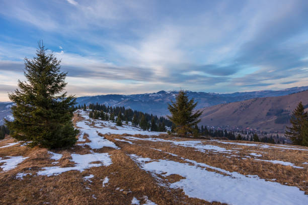 istock Sunset spring Carpathian mountains landscape with snow-covered ridge. 1211638875