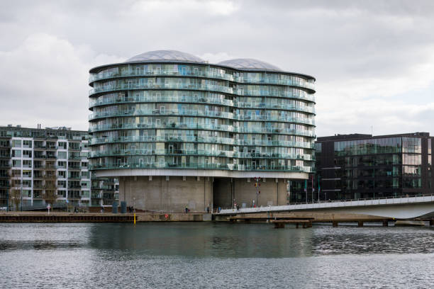 Copenhagen, Denmark - March 04, 2020: Modern building Gemini Residence at Sydhavnen channel embankment, that was rebuilt from two silos towers