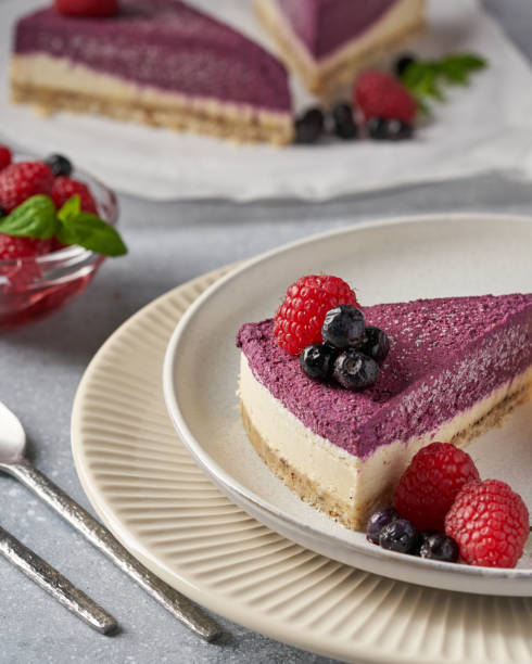 istock raw vegan double-layer cake with black currant on a light gray background under a concrete texture. Healthy eating, delicious dessert without baking 1211639866