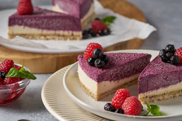 istock raw vegan double-layer cake with black currant on a light gray background under a concrete texture. Healthy eating, delicious dessert without baking 1211639867