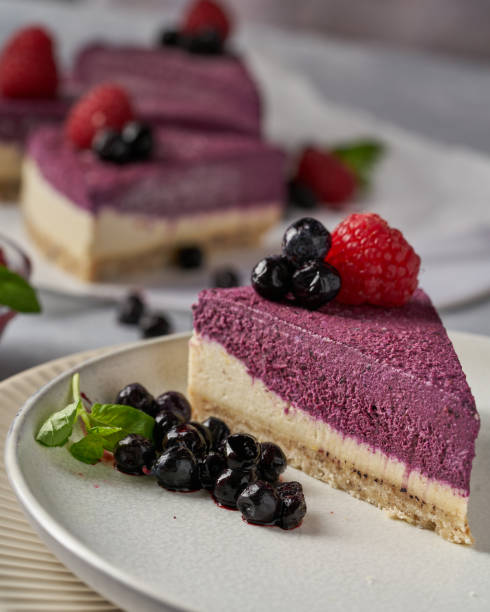 istock raw vegan double-layer cake with black currant on a light gray background under a concrete texture. Healthy eating, delicious dessert without baking 1211639910