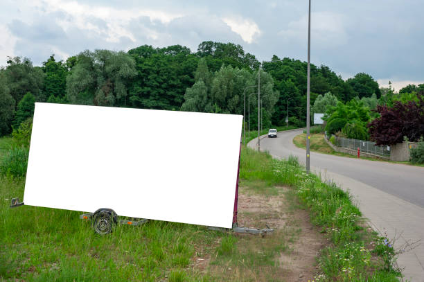 istock Blank white portable billboard mockup mounted on the trailer 1211641134