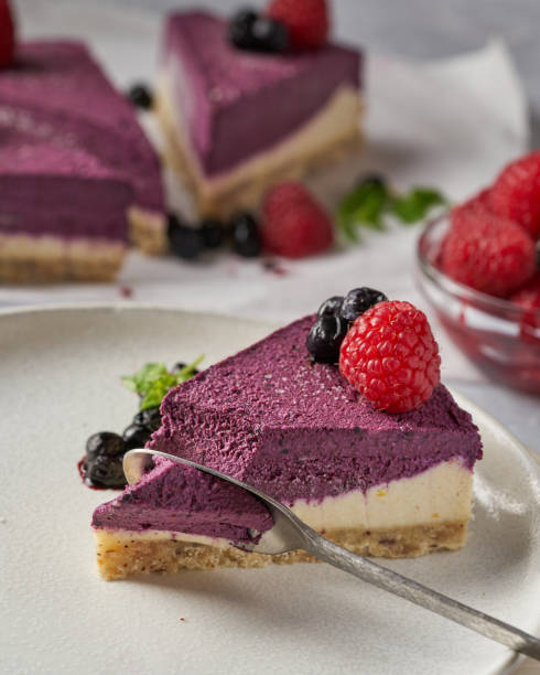 istock raw vegan double-layer cake with black currant on a light gray background under a concrete texture. Healthy eating, delicious dessert without baking 1211641736