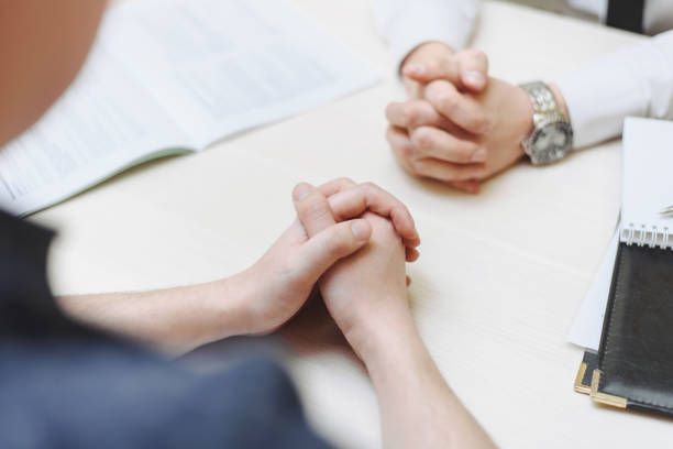 istock Hand, two men on a desk. Negotiating business. Communication and negotiations between two businessmen 1211642718