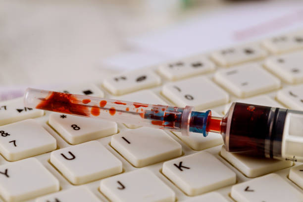 istock Corona virus inscription with syringe and blood inside Covid 19 outbreak 1211642743