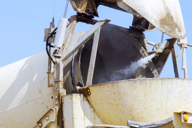 istock Cement truck mixer pouring cement 1211642795
