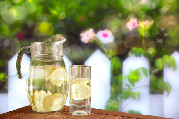 fresh lemonade on green garden table