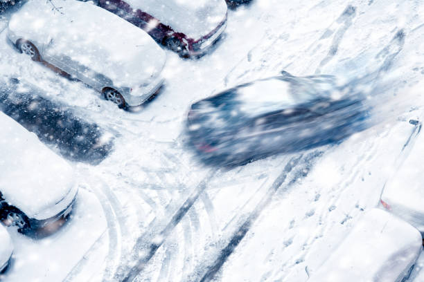 istock car driving on frozen road 1211644434