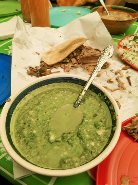 Typical Mexican dish called barbecue, accompanied by green sauce. stock photo